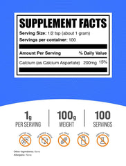 BulkSupplements Calcium Aspartate powder measuring spoon ready for smoothies or drinks.