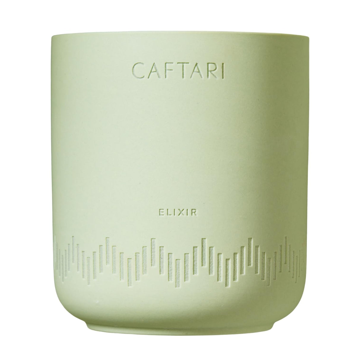 Caftari Elixir candle with bergamot, mandarin, and tea notes brightening a room