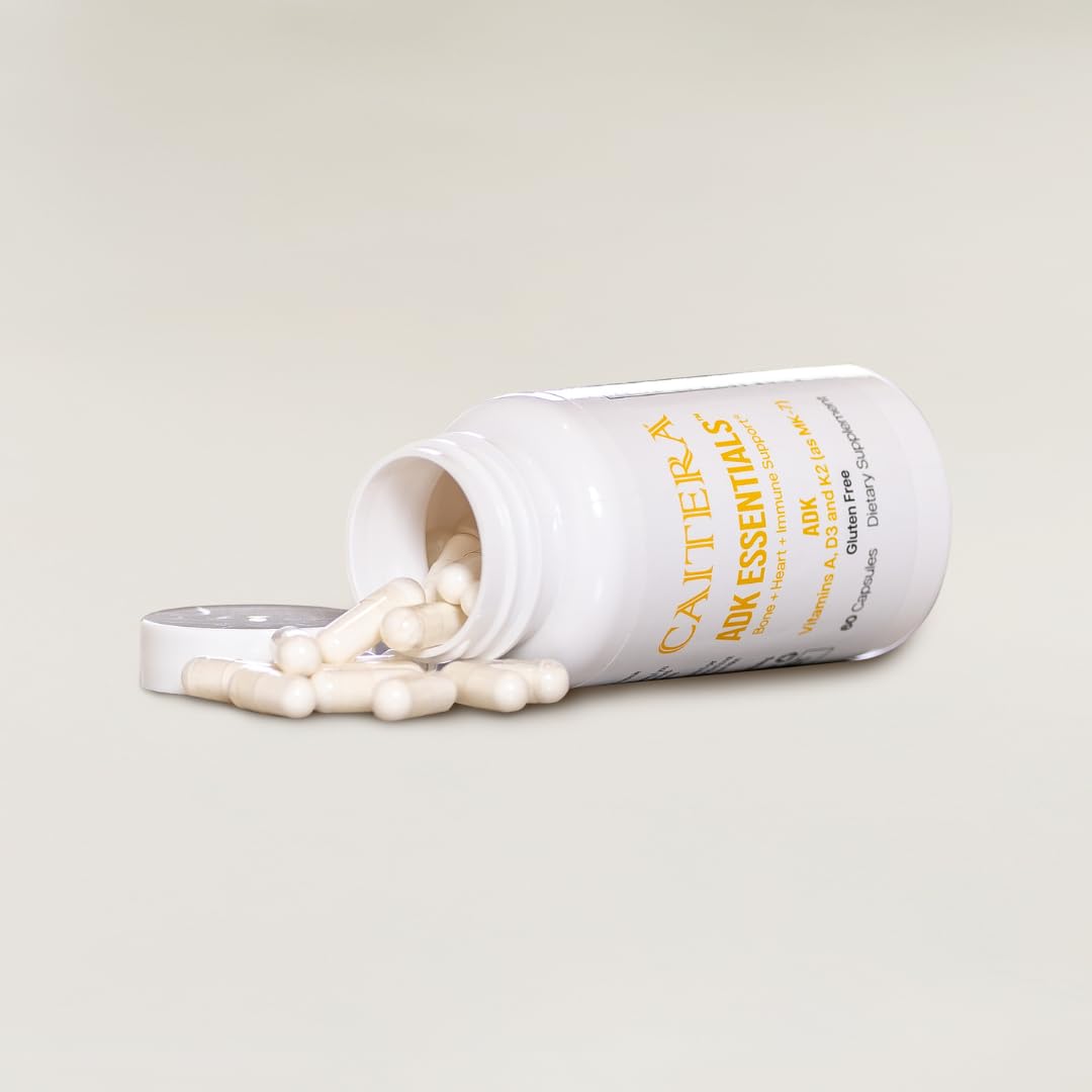 Caitera ADK Essentials bottle on neutral surface for daily vitamin routine and immune support.
