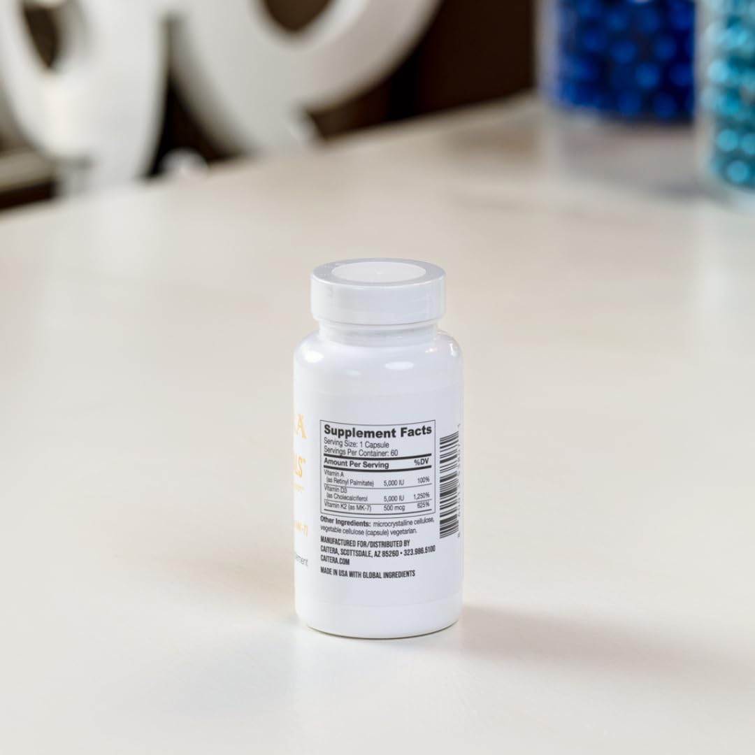 Caitera ADK Essentials capsules with glass of water for easy calcium absorption.