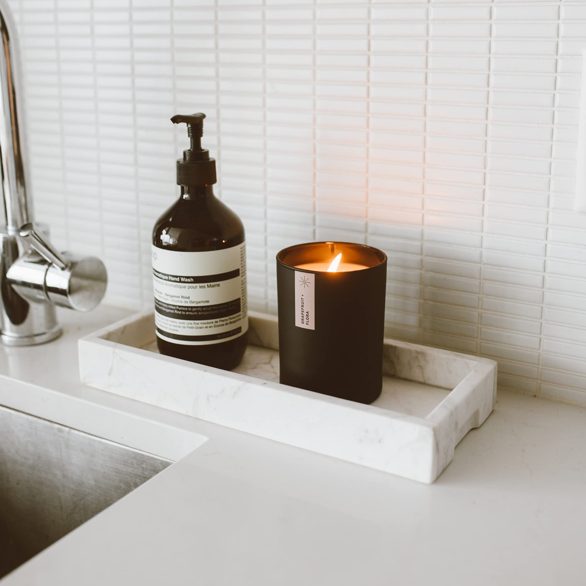 Calyan Wax Co. Grapefruit and Flora in a cozy bedroom setting
