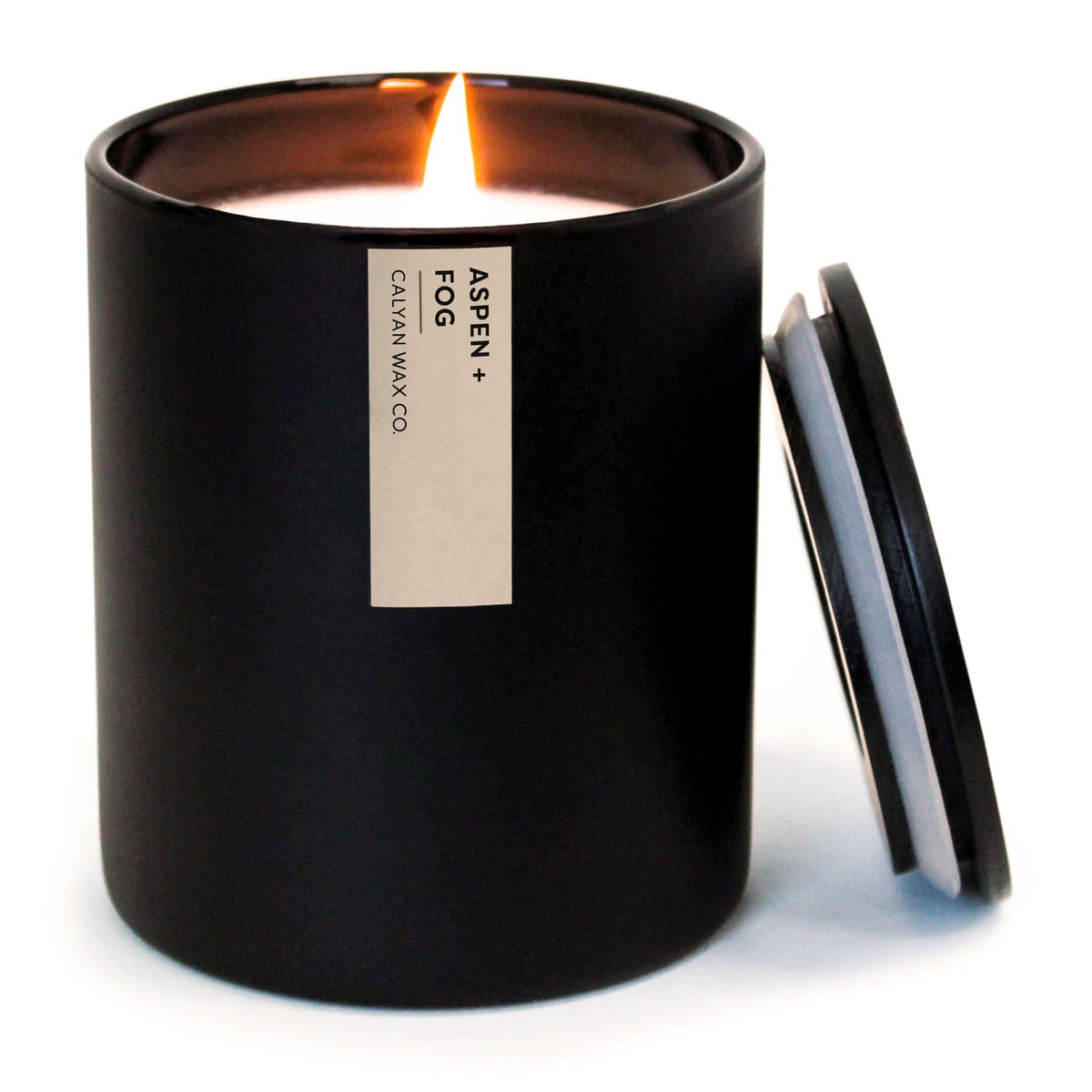 Calyan Wax Co. Aspen & Fog black tumbler jar candle adds sophisticated ambiance.