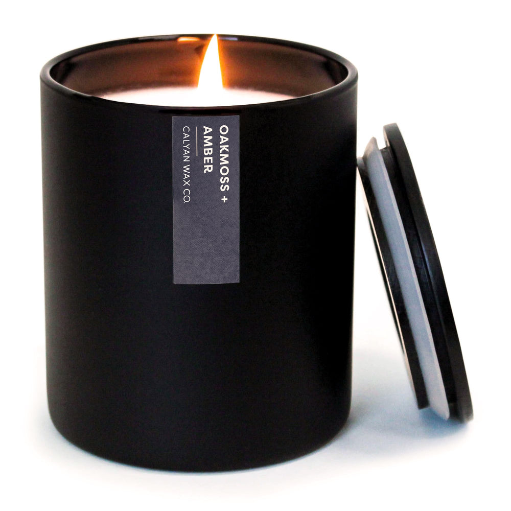 Calyan Wax Co. Oakmoss & Amber candle label highlights premium fragrance notes.