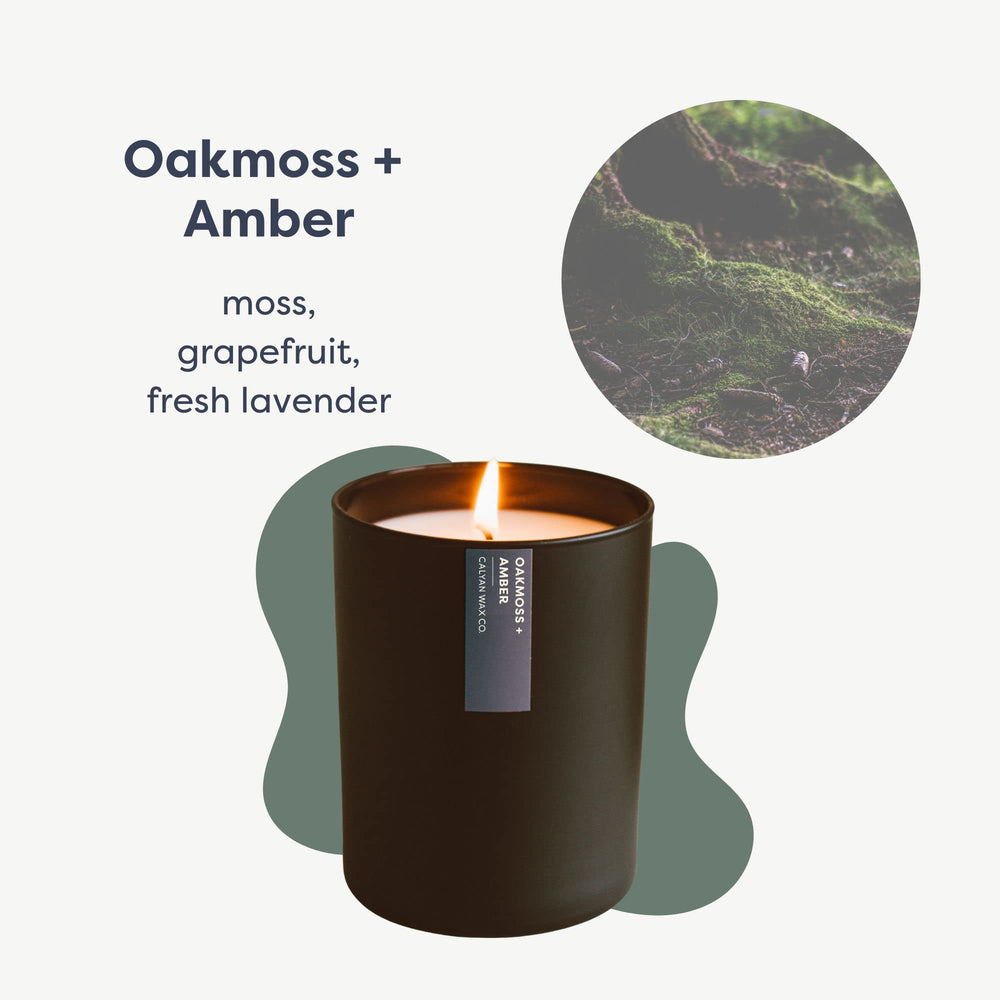 Calyan Wax Co. Oakmoss & Amber candle in tumbler enhances space with long-lasting scent.