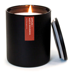 Calyan Wax Co. Apples and Maple Bourbon candle in a black jar for warm, inviting ambiance.