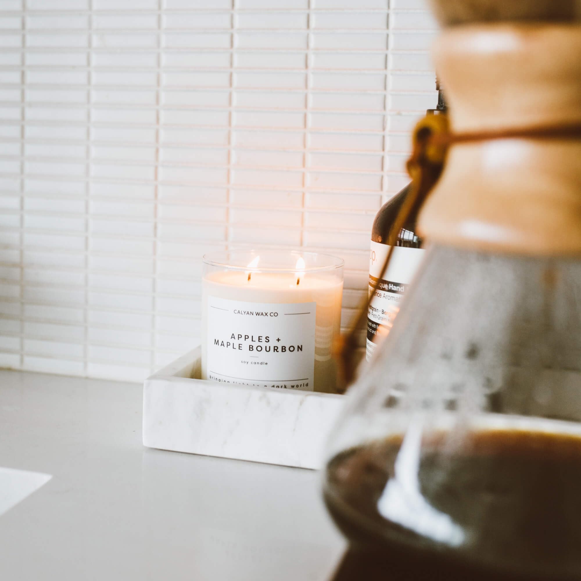 Calyan Wax Co. Apples & Maple Bourbon soft glow supports relaxed, productive study sessions.