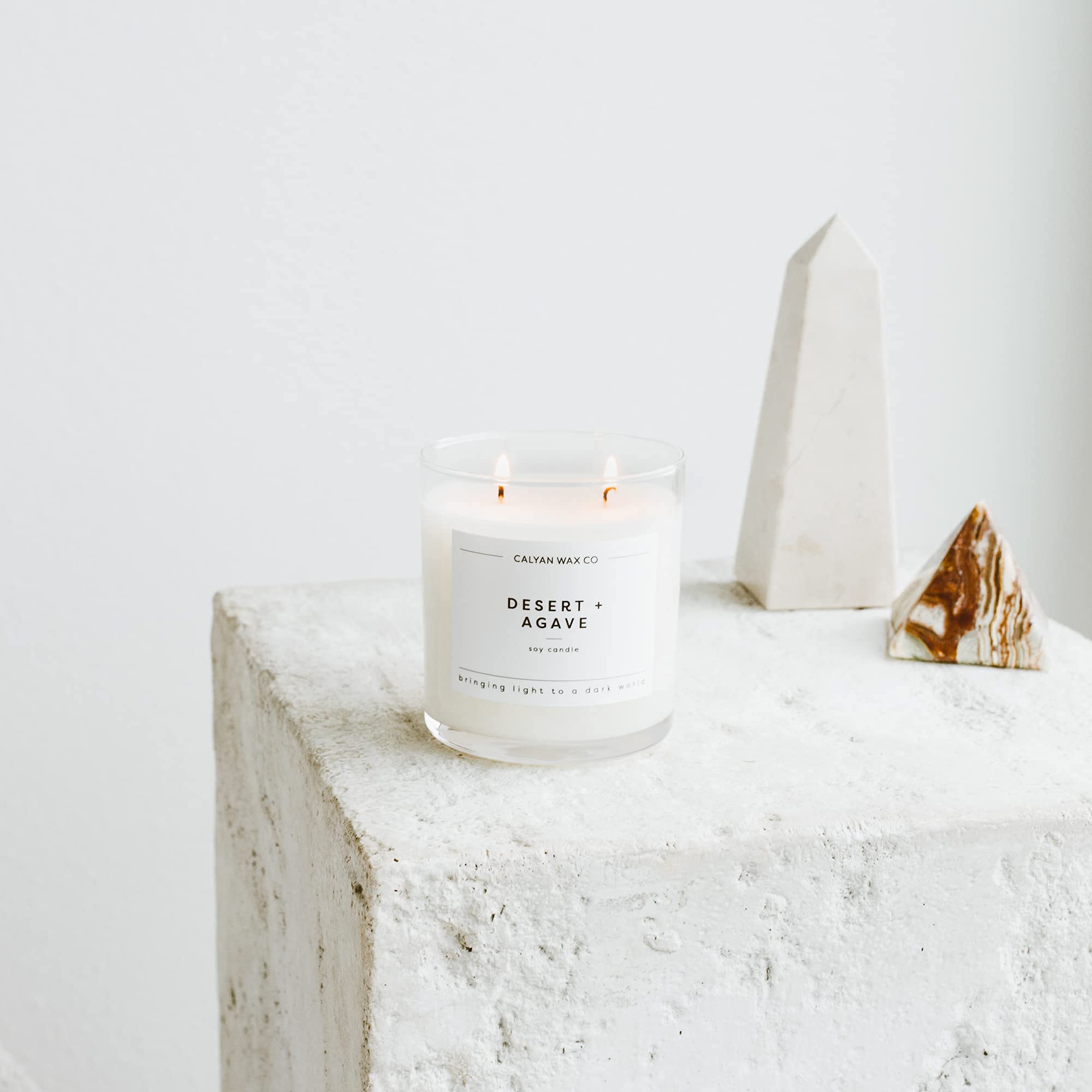 Calyan Wax Co Desert Agave candle close-up shows plant-based ingredients and natural oils.