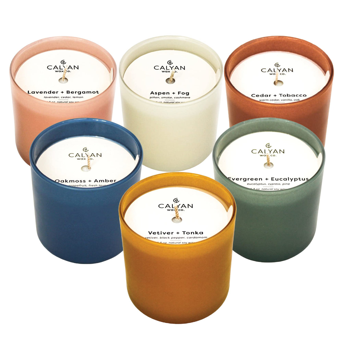 Calyan Wax Co. Dignity Aspen & Fog candle in a ceramic jar adds cozy fragrance.