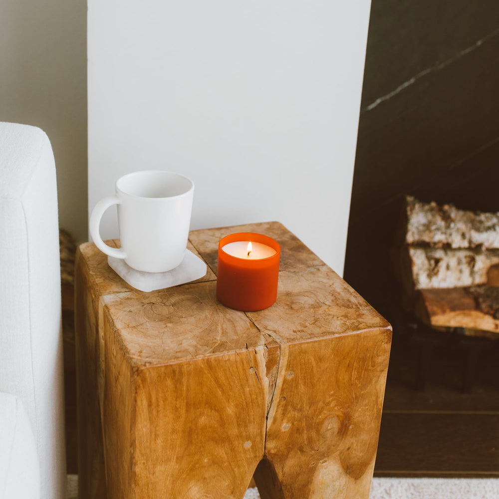Calyan Wax Co. Dignity Oakmoss & Amber fills a dining area with earthy warmth.