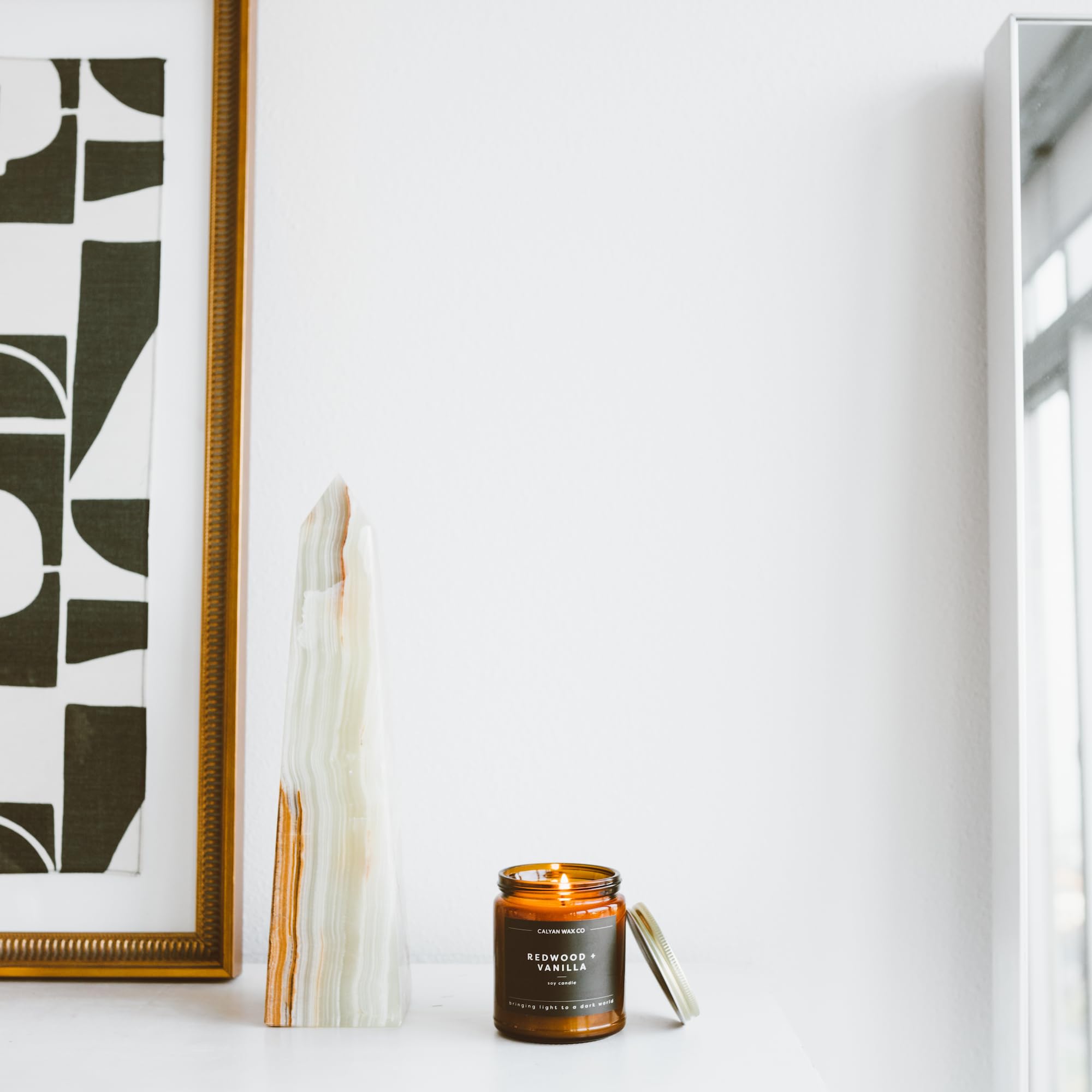 Essential oils blend in Calyan Wax Co Redwood & Vanilla candle.