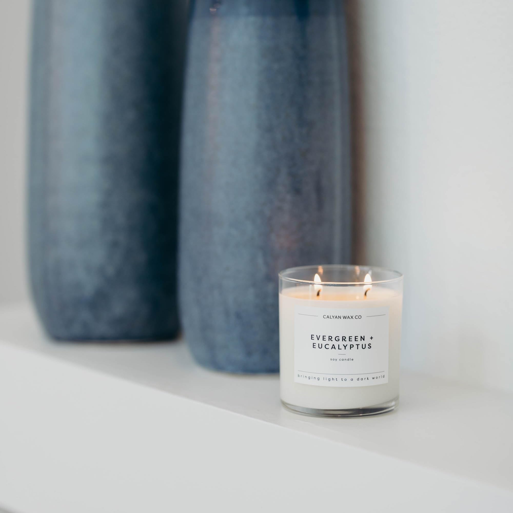 Calyan Wax Co. packaging showcases Evergreen & Eucalyptus candle.