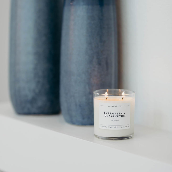 Calyan Wax Co. packaging showcases Evergreen & Eucalyptus candle.