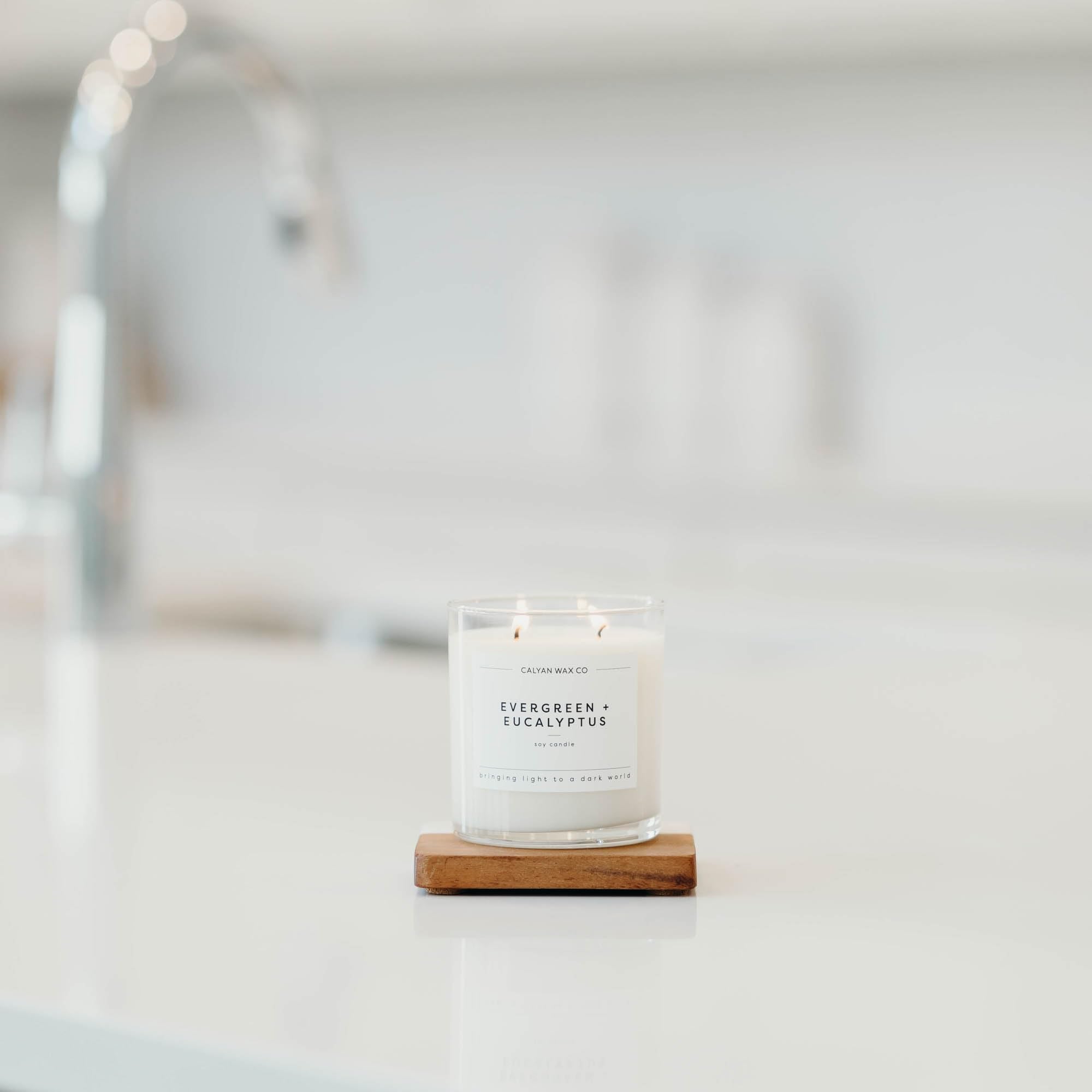 Calyan Wax Co. evergreen-eucalyptus jar detail highlights dual wicks.