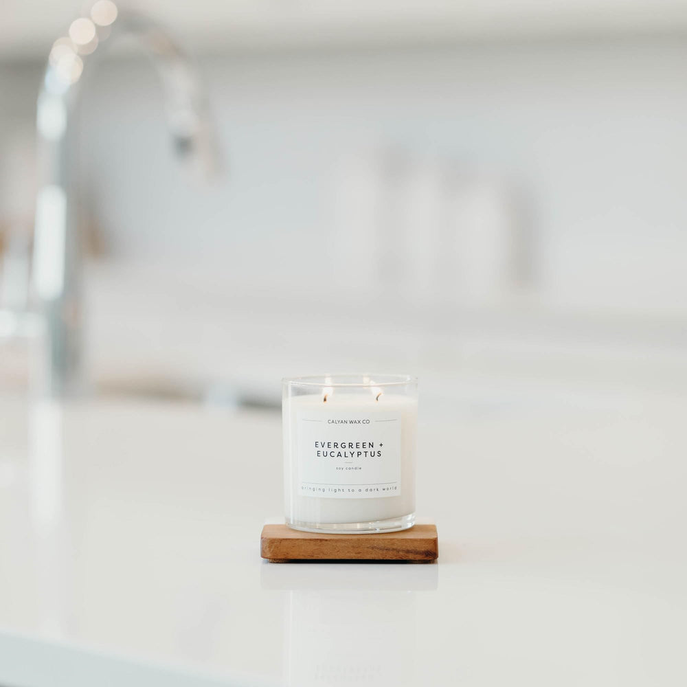 Calyan Wax Co. evergreen-eucalyptus jar detail highlights dual wicks.