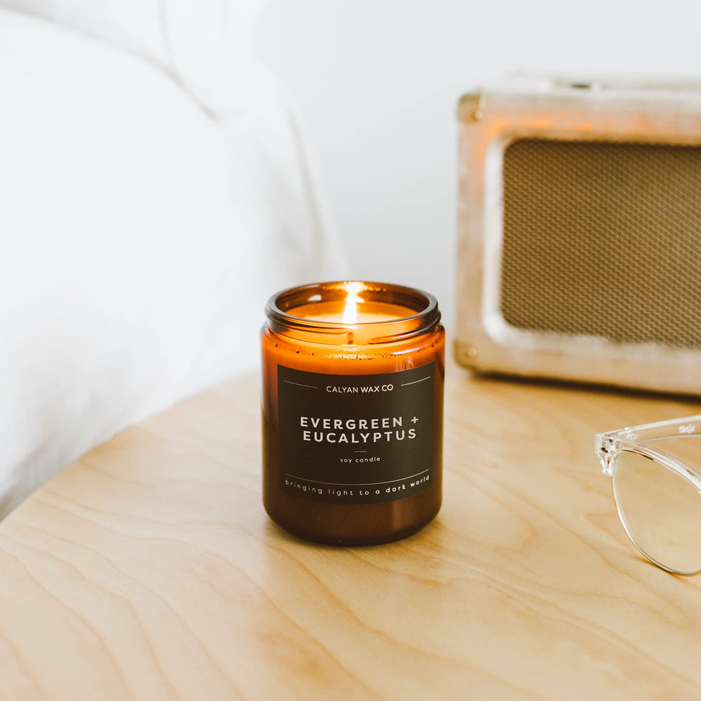 Calyan Wax Co Evergreen Eucalyptus scent swirls in amber glass