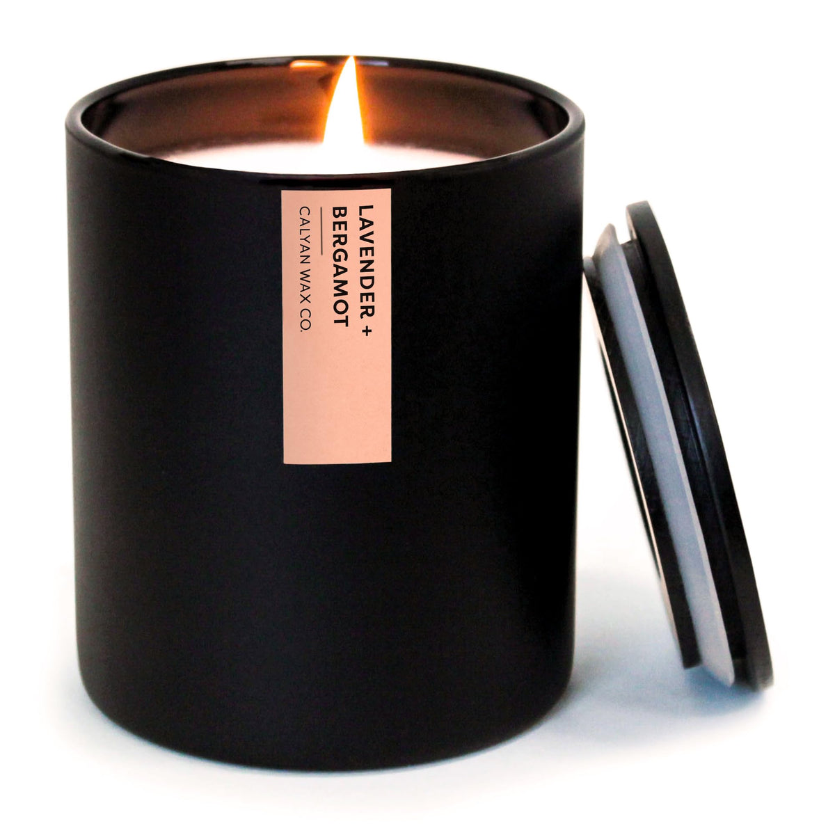 Calyan Wax Co lavender bergamot scented candle in a black tumbler for calming bedroom ambiance.