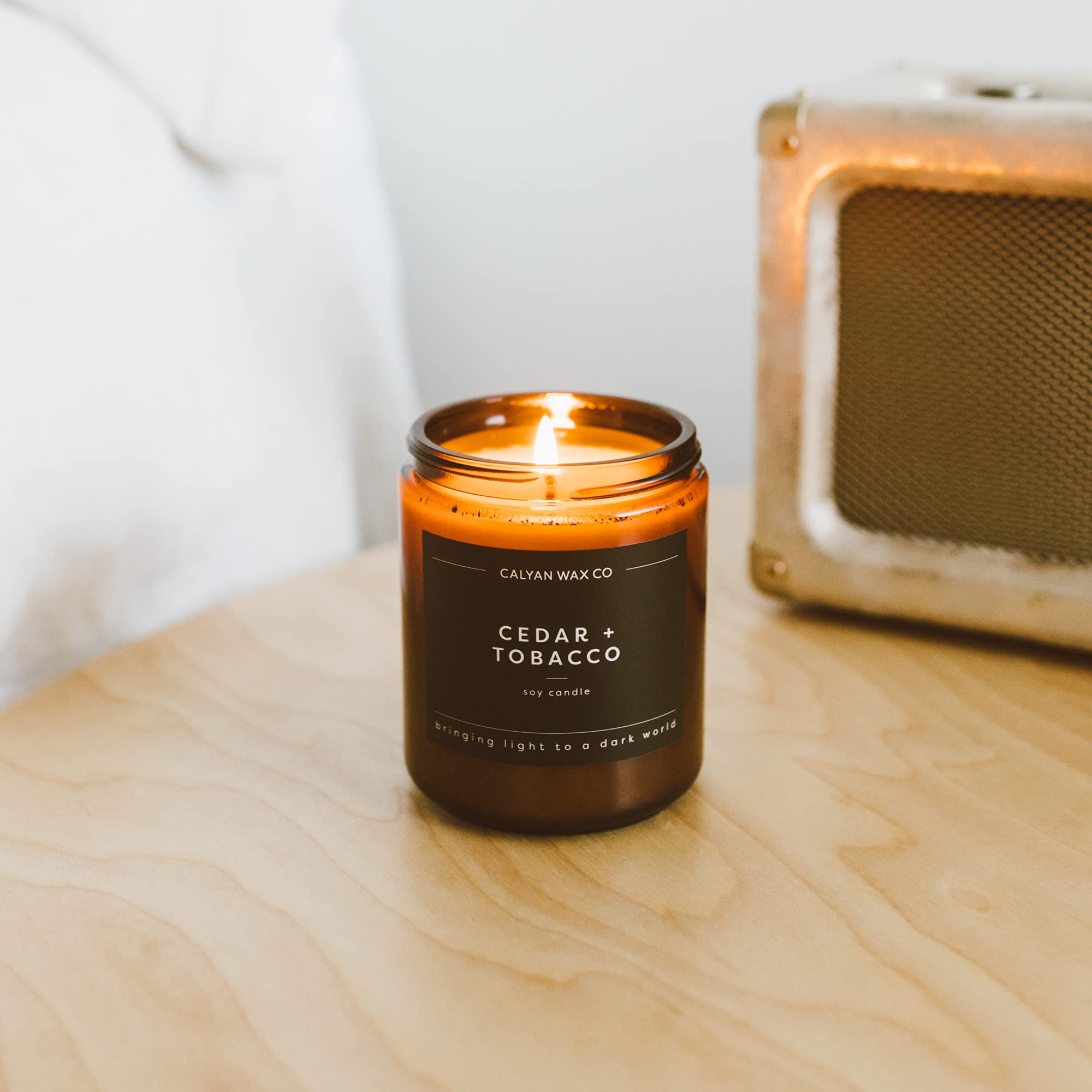 Calyan Wax Co. cedar-tobacco aroma in a cozy medium room setup