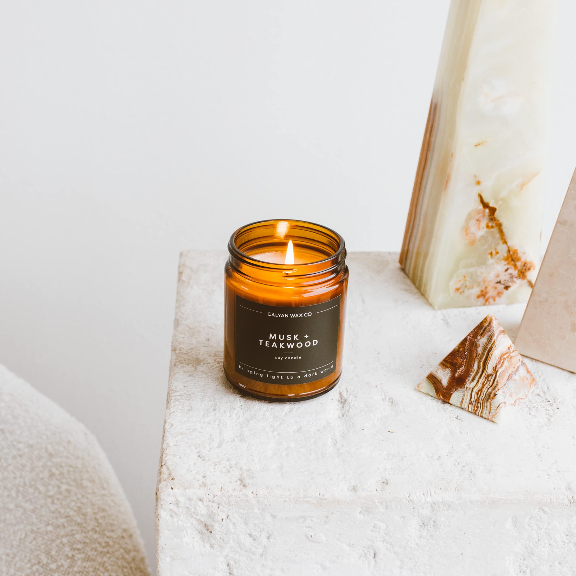 Calyan Wax Co Musk & Teakwood wick closeup shows metal free cotton wick in action