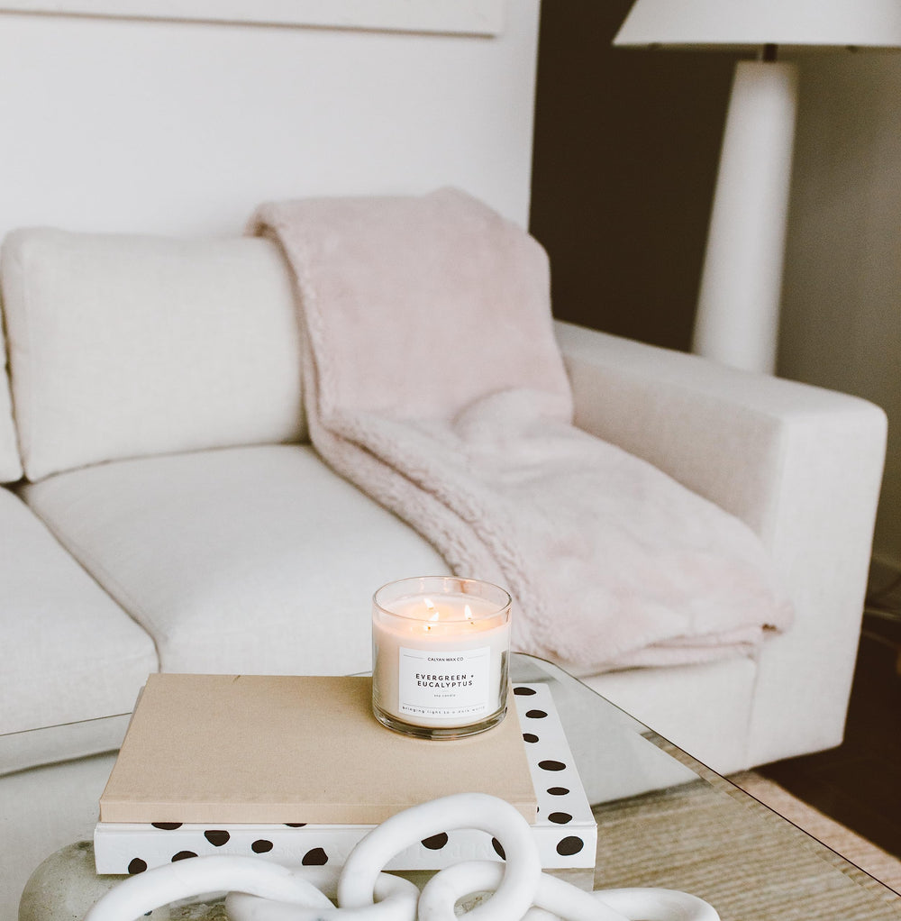 Calyan Wax Co Oakmoss Amber candle in bedroom for relaxing atmosphere