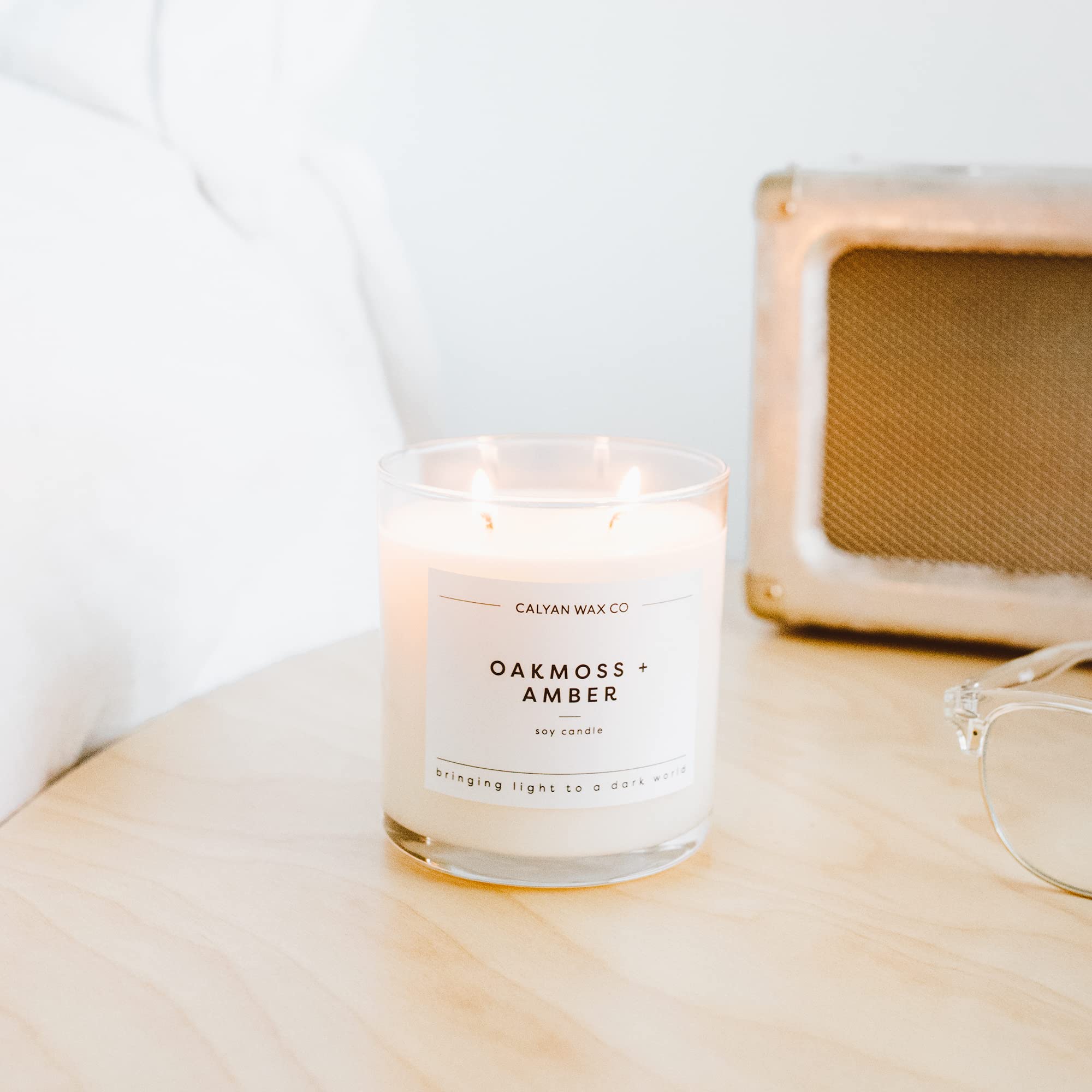 Calyan Oakmoss & Amber large glass jar candle ideal for gifting.