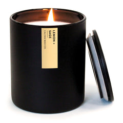 Calyan Wax Co Passionfruit & Ginger candle in a black tumbler enhances room fragrance