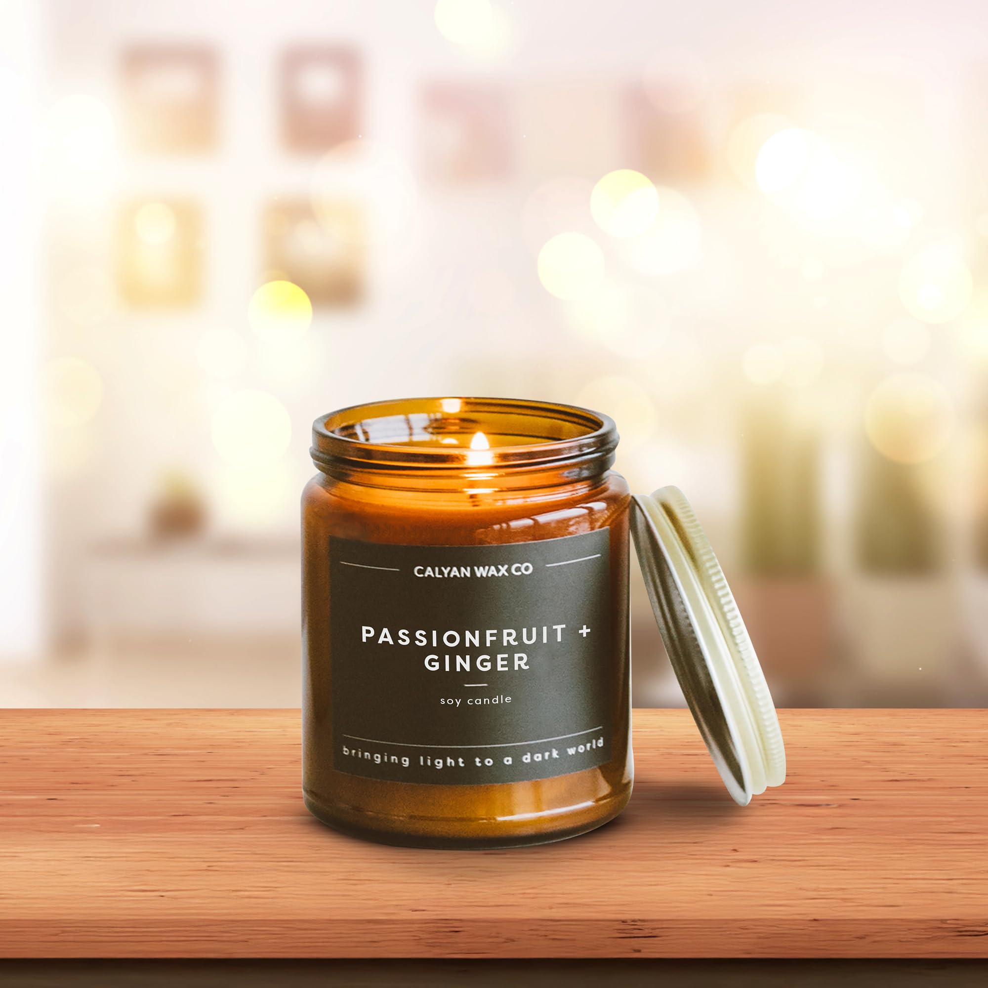 Calyan Wax Co. candle lit at dusk creates a warm glow.