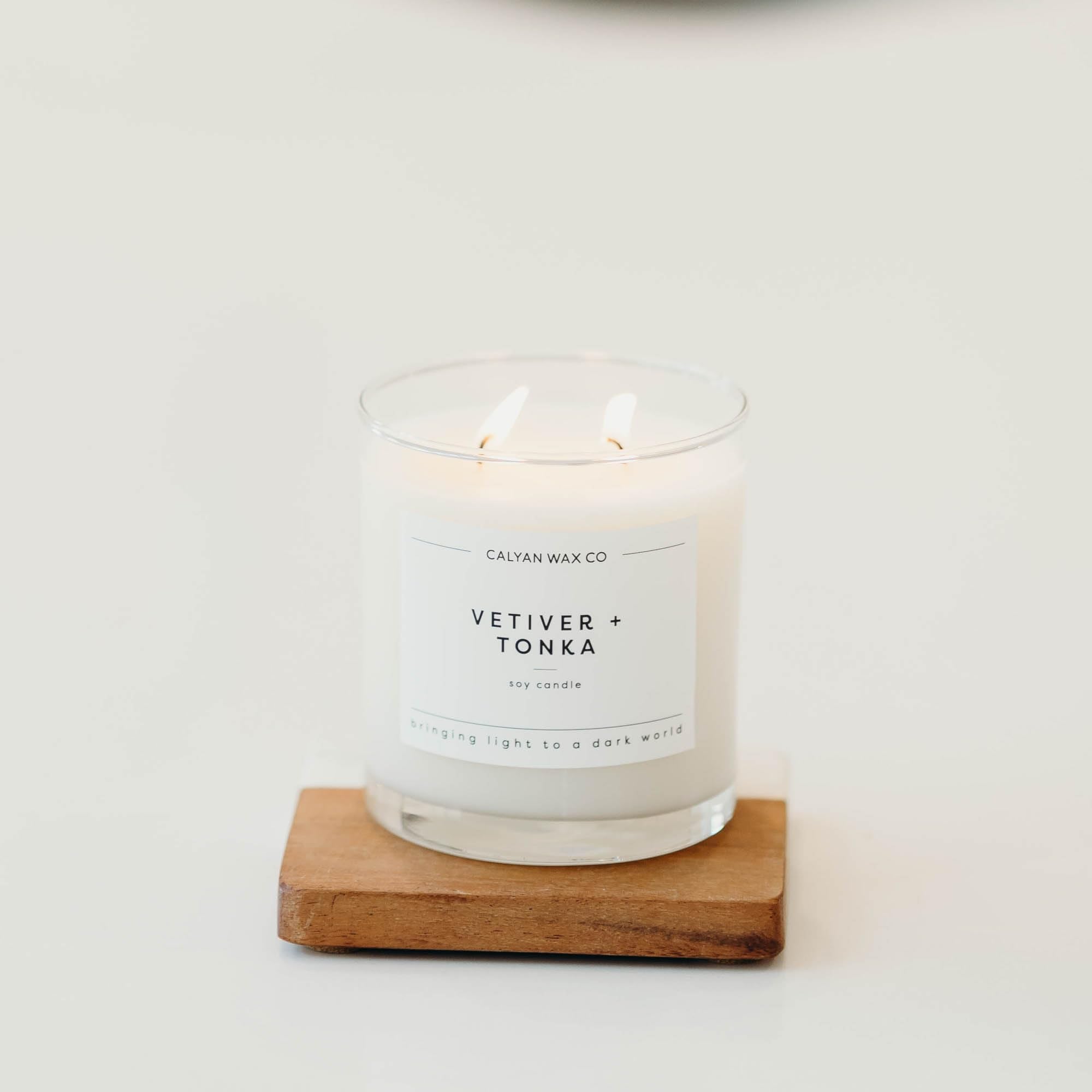 Calyan Wax Co Vetiver Tonka on a clean surface as décor.