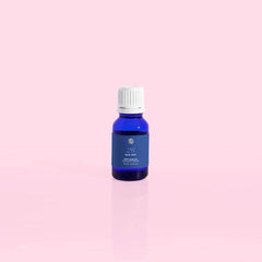 Capri Blue Blue Jean bottle with aroma droplets for diffuser use.