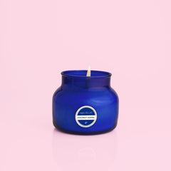 Capri Blue Coconut Santal jar close-up highlighting vibrant blue glass for elevated room decor