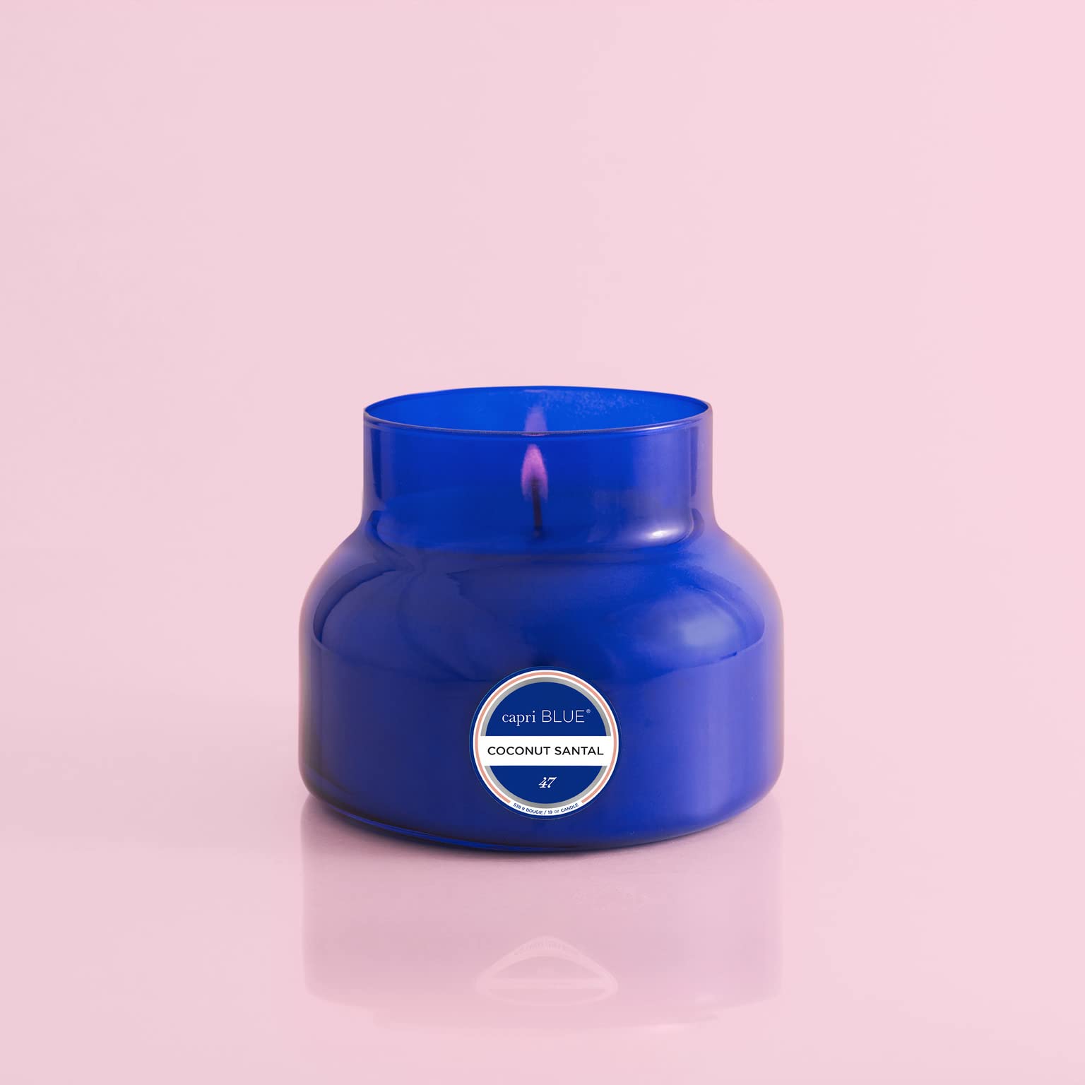 Capri Blue Honeydew Crush fragrance notes visualization beside jar