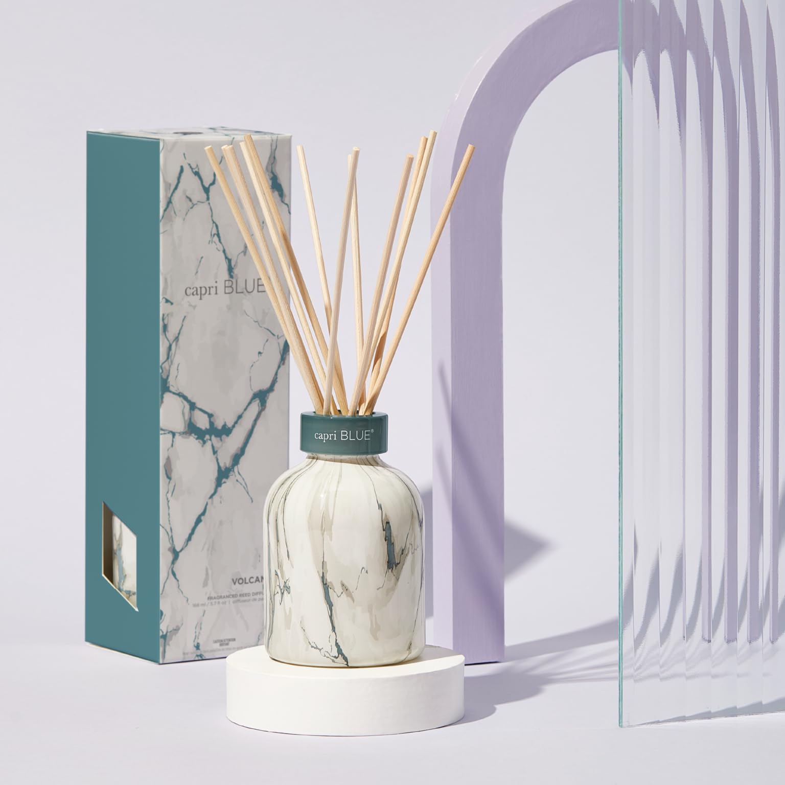 Capri Blue Modern Marble Reed Diffuser Set reed sticks release subtle fragrance.
