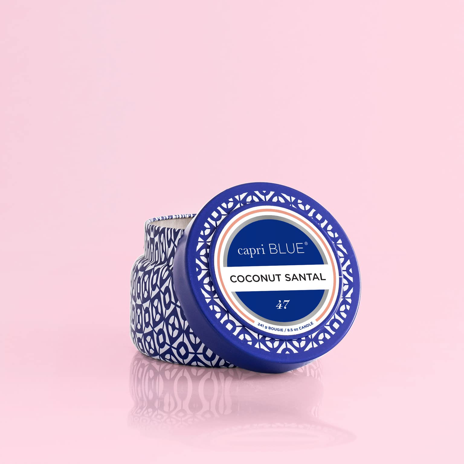 Capri Blue travel tin jar with lid showcases vibrant cobalt blue design.