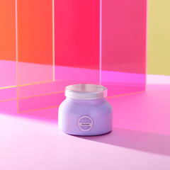 Capri Blue Volcano Lavender Petite Jar candle lit to fill a cozy space with island citrus notes