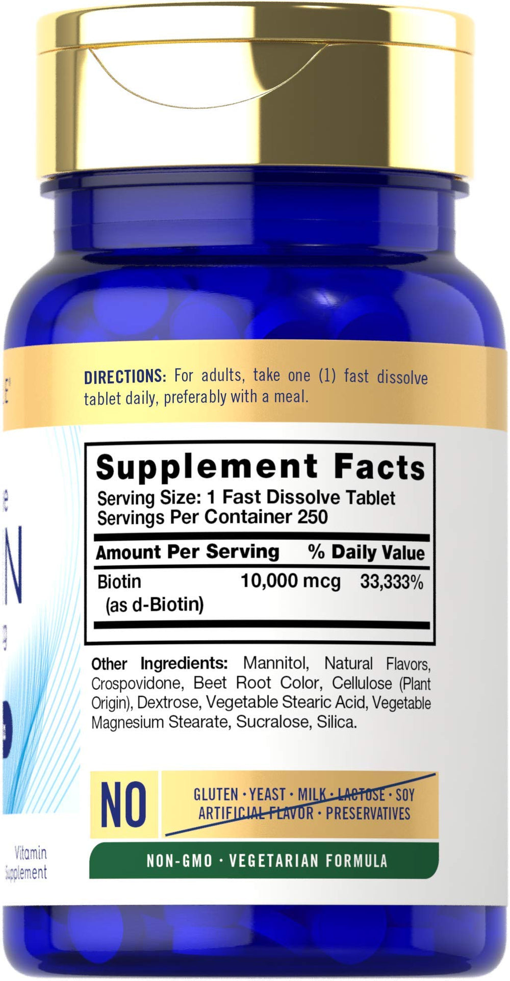 Carlyle Biotin berry-flavor fast-dissolve tablets close-up in hand.