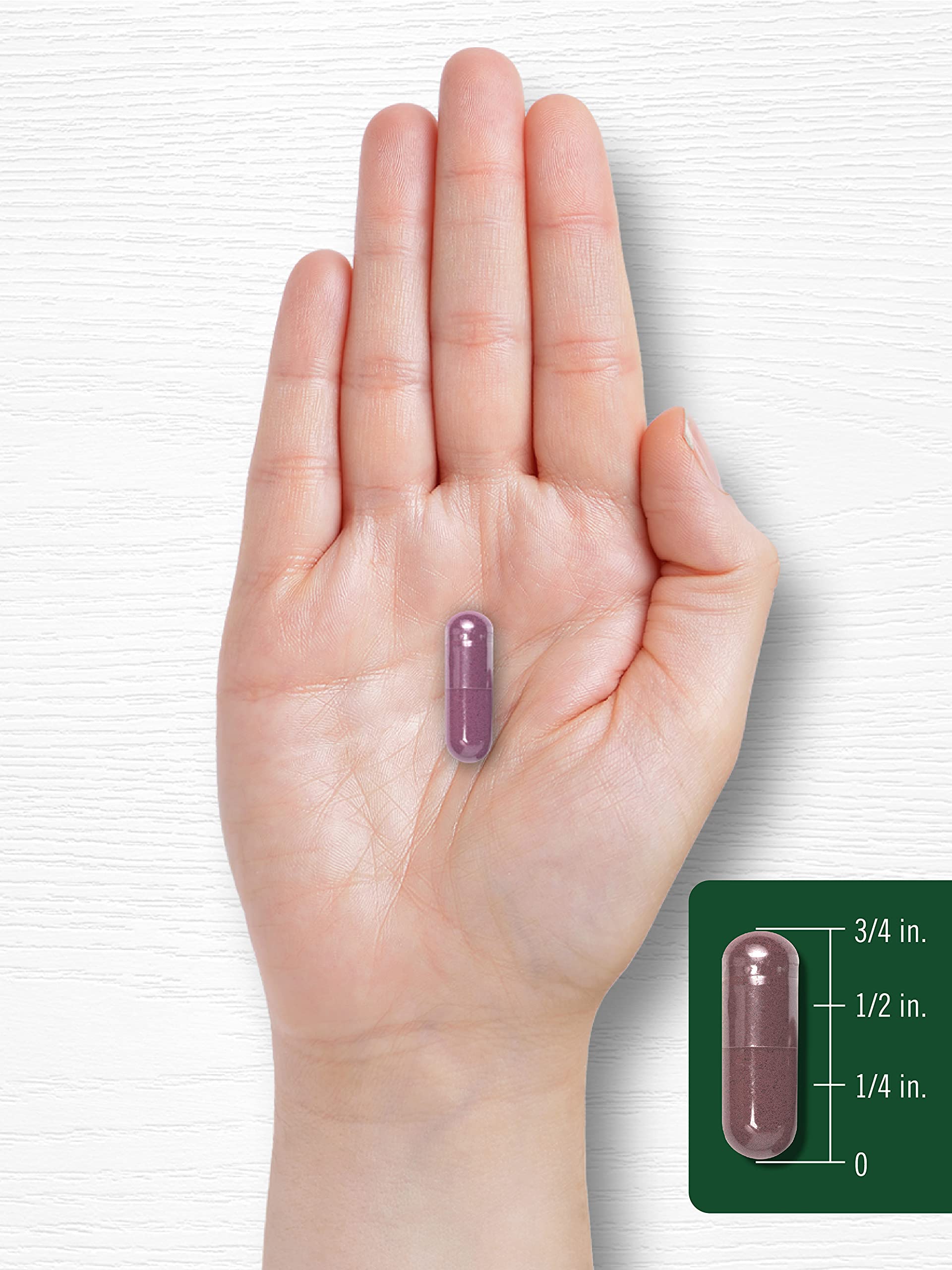 Holding Carlyle Grape Seed Extract bottle for daily routine.