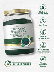 Pouring spirulina powder into a glass for a vibrant green drink.