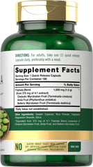 Carlyle Triphala capsules close-up highlighting Haritaki, Bibhitaki, and Amla blend.