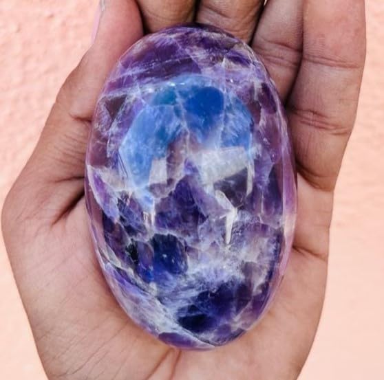 Carved crystal lingam amethyst for energy balance and ritual use.