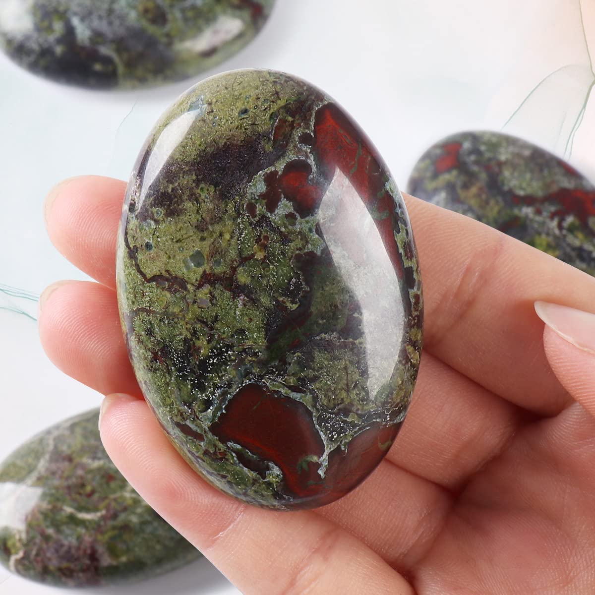 CASMON Dragon Bloodstone pocket stone used for grid meditation and ritual use.