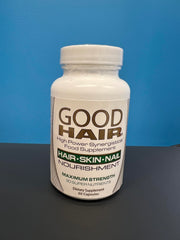 Century Systems Good Hair capsules in hand suggest convenient daily capsules for hair and nail support.