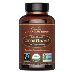 Ceylon Cinnamon Shop CinnaGuard bottle close-up with organic certification logos.