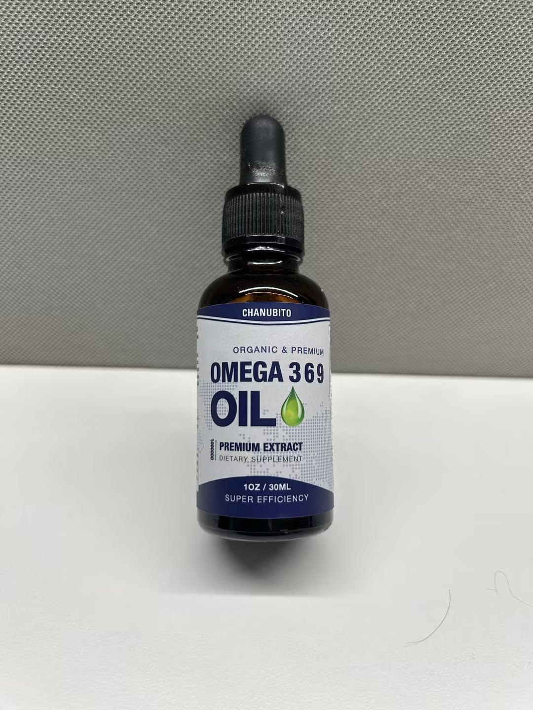 CHANUBITO Omega Oil Drops label close-up with organic quality cues.