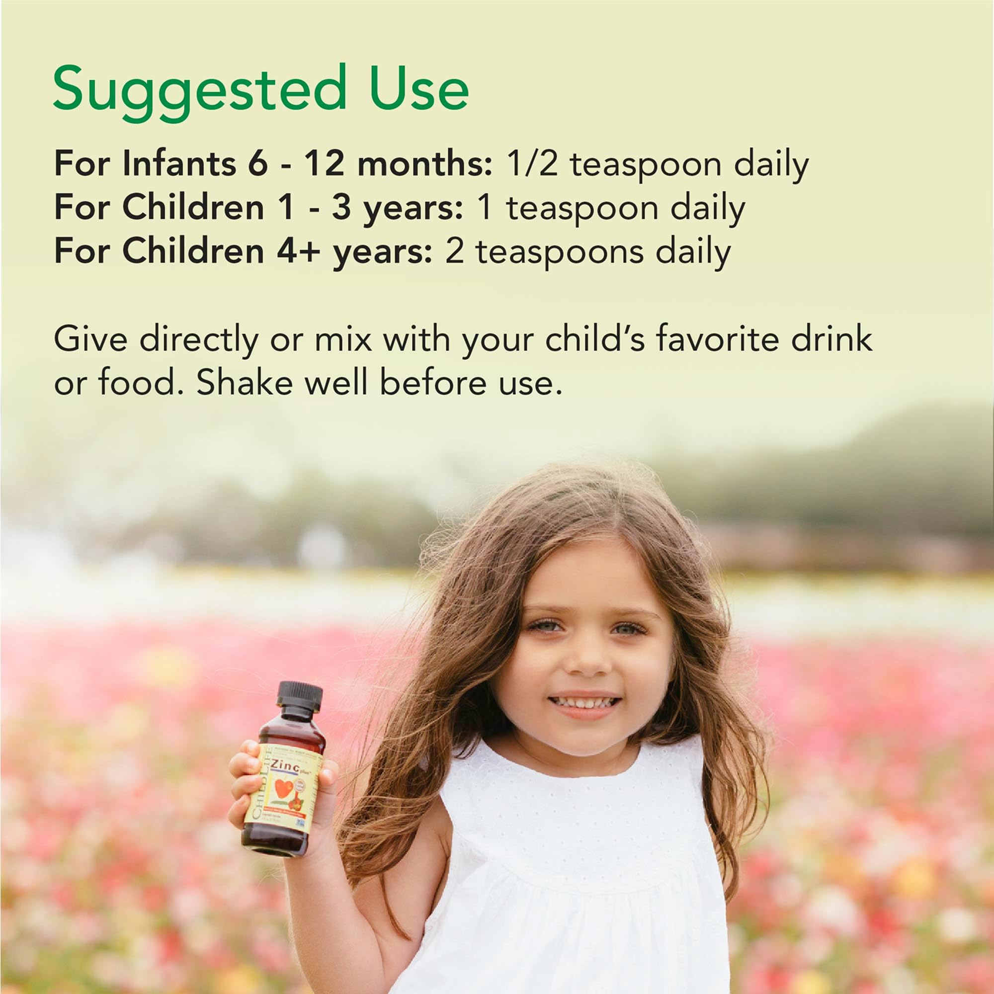 Pouring CHILDLIFE ESSENTIALS Zinc Plus into a kid-friendly cup.