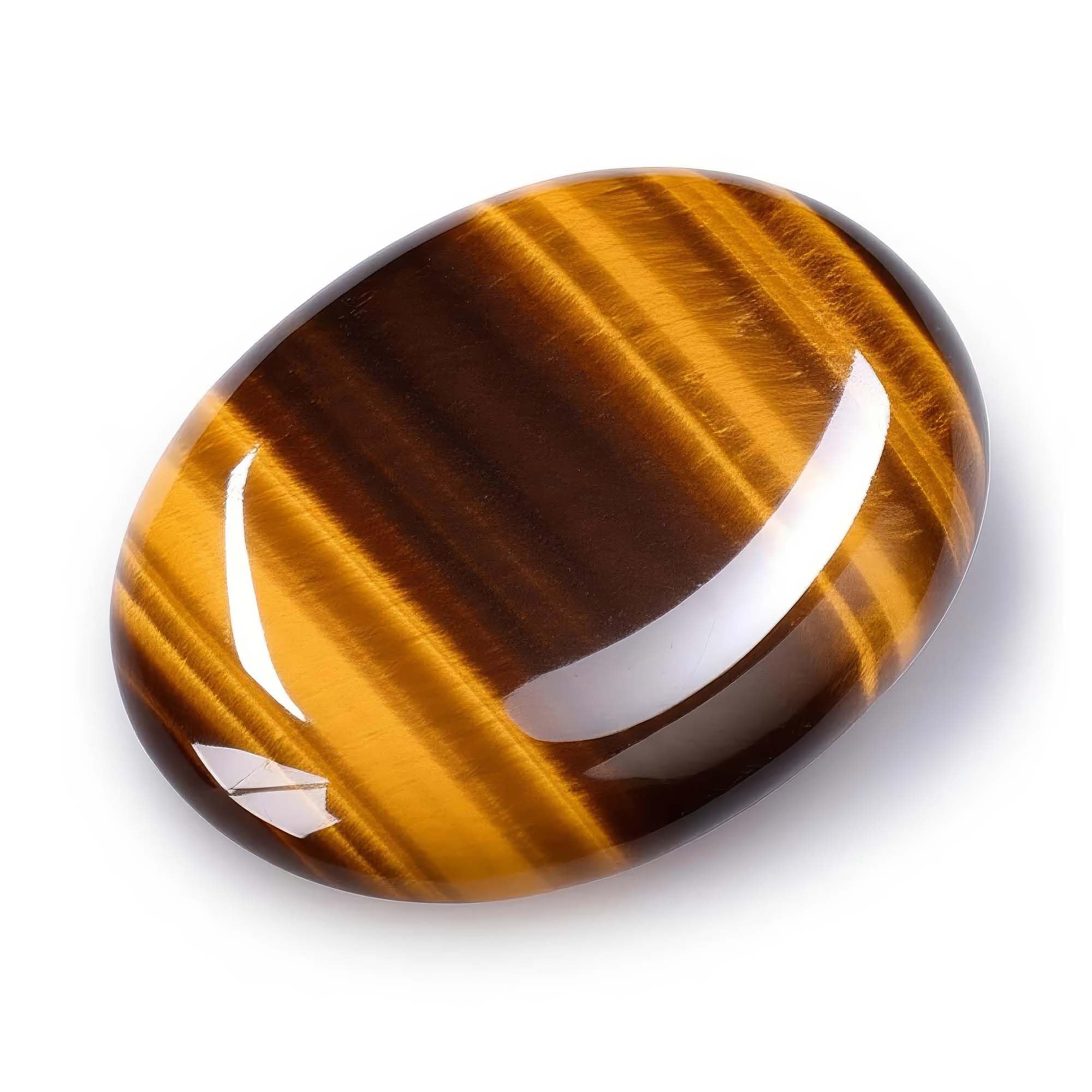 Chiorgone Tiger's Eye thumb stone closeup highlighting its warm shimmer and smooth grip.
