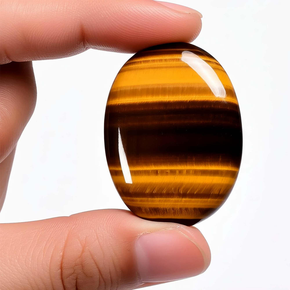 Chiorgone Tiger's Eye thumb stone used in meditation for focus and inner calm.