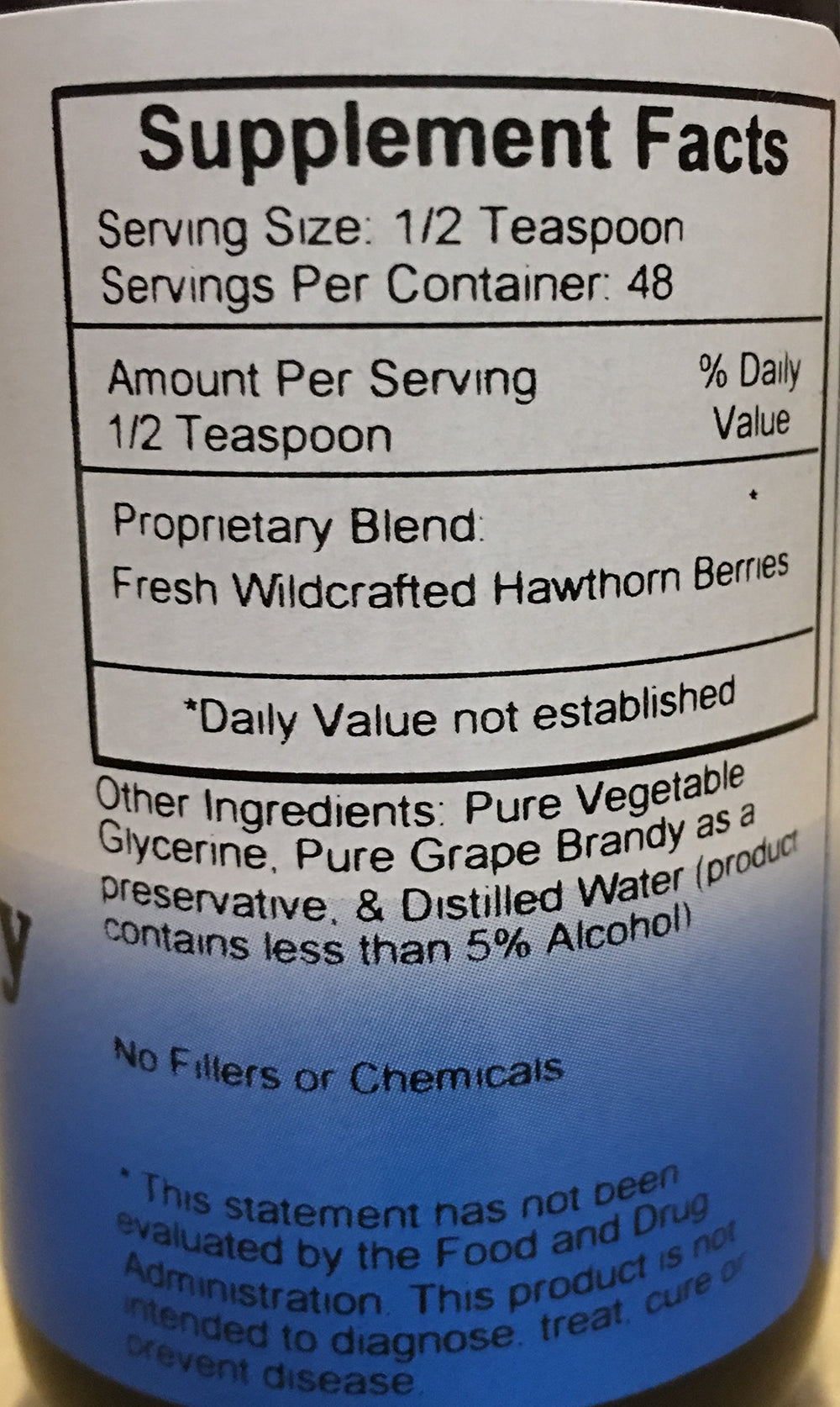 Dispensing Hawthorn Berry Heart Syrup with a dropper for easy daily use.