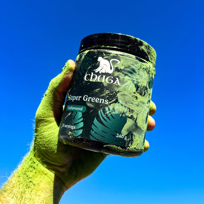 Chuga's Super Greens powder dissolving in water for easy mixing.