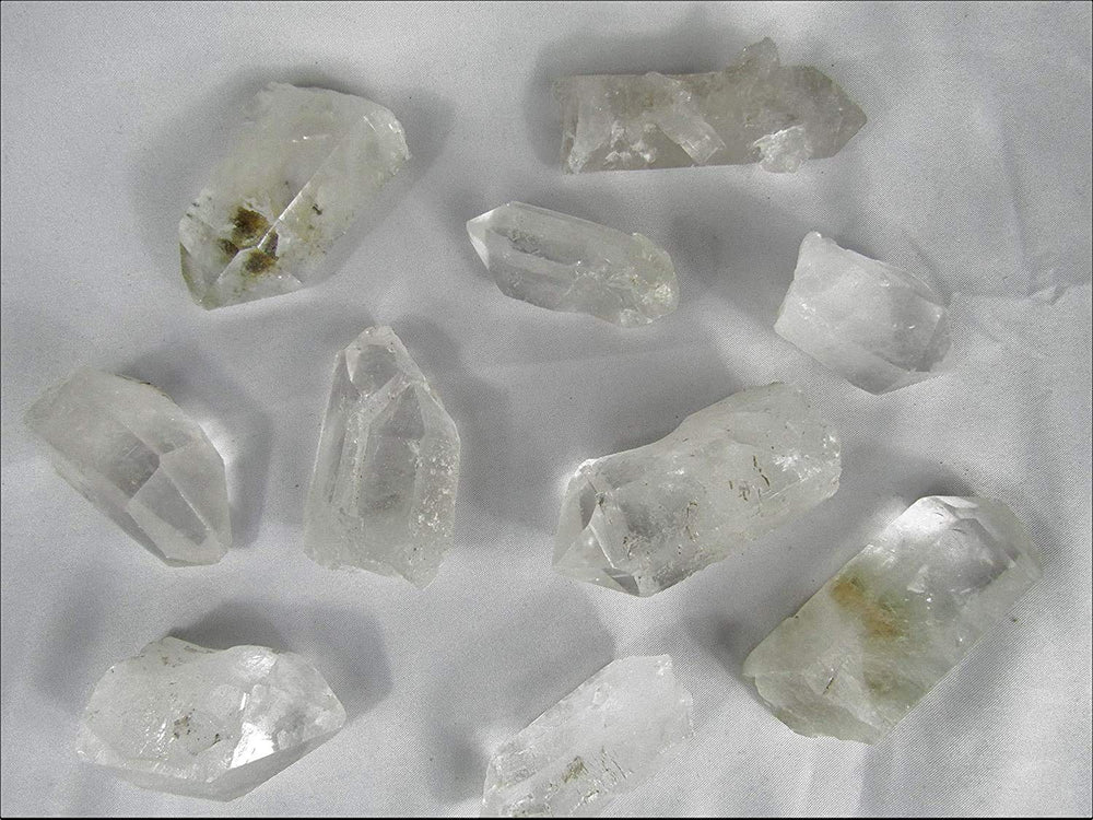 CircuitOffice clear quartz points for tumbling and polishing with bright facets.