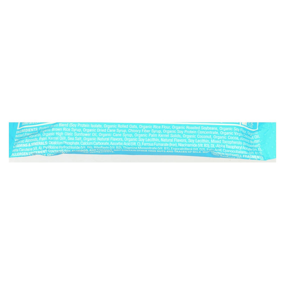 Holding a Luna Bar chocolate-dipped coconut for quick energy on-the-go.
