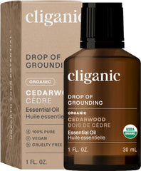 Cliganic Cedarwood essential oil bottle for diffusion and calming ambiance.